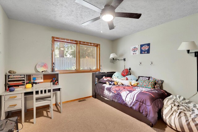10612 E 46th Ave, Spokane Valley, WA 99206 - bedroom with carpet floors, a textured ceiling, an office area, and a ceiling fan