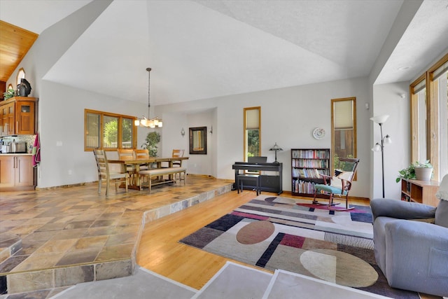 10612 E 46th Ave, Spokane Valley, WA 99206 - living room with vaulted ceiling and a chandelier