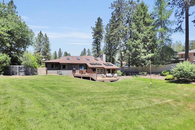 10612 E 46th Ave, Spokane Valley, WA 99206 - back of house featuring a deck, a fenced backyard, and a chimney