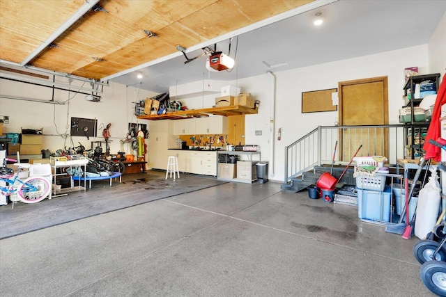 10612 E 46th Ave, Spokane Valley, WA 99206 - garage with a workshop area and a garage door opener