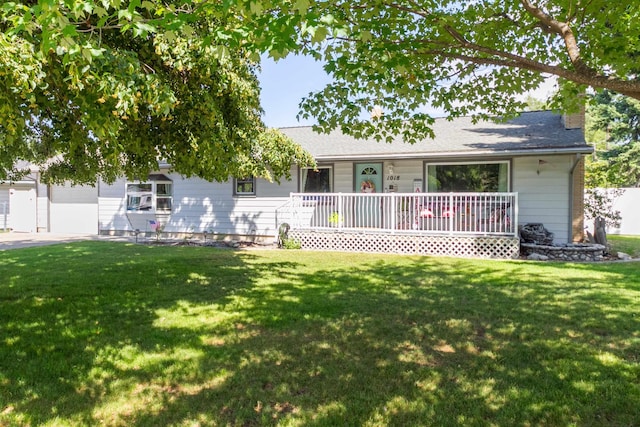 1018 N Fox Rd, Spokane Valley, WA 99206 - rear view of property with a chimney, a lawn, and covered porch