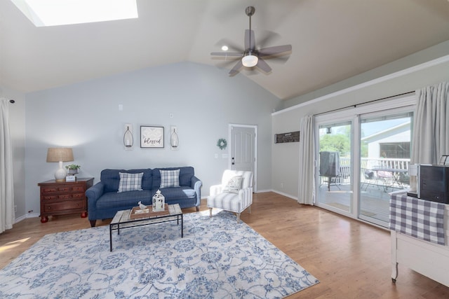 1018 N Fox Rd, Spokane Valley, WA 99206 - living room featuring a ceiling fan, vaulted ceiling, wood finished floors, and a skylight