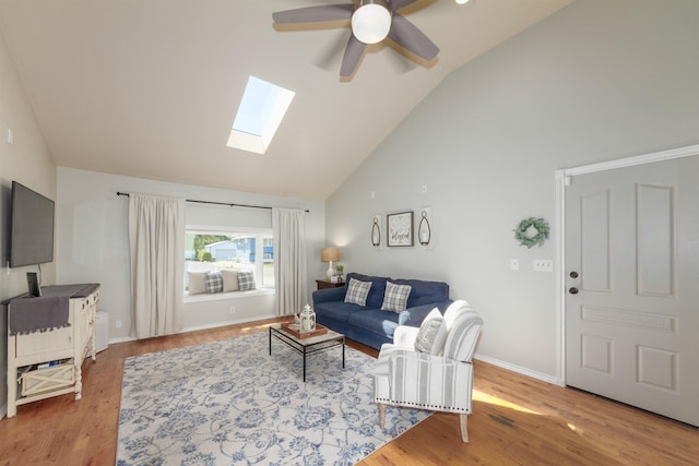 1018 N Fox Rd, Spokane Valley, WA 99206 - living area featuring a skylight, a ceiling fan, wood finished floors, and high vaulted ceiling