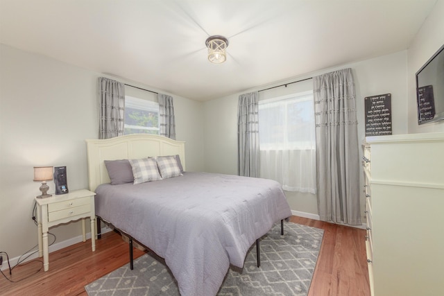 1018 N Fox Rd, Spokane Valley, WA 99206 - bedroom with light wood-style floors and baseboards
