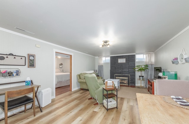 1018 N Fox Rd, Spokane Valley, WA 99206 - living area featuring crown molding, a fireplace, and wood finished floors