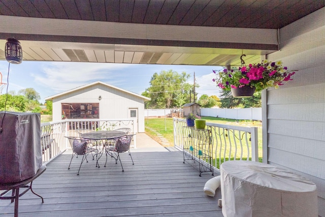 1018 N Fox Rd, Spokane Valley, WA 99206 - wooden deck with outdoor dining space and a shed