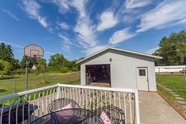 1018 N Fox Rd, Spokane Valley, WA 99206 - wooden deck featuring a detached garage and an outdoor structure