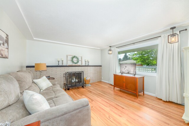 1018 N Fox Rd, Spokane Valley, WA 99206 - living area featuring wood finished floors and a fireplace
