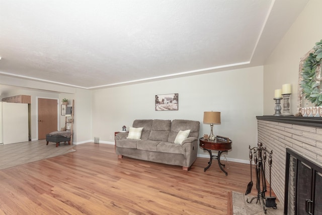 1018 N Fox Rd, Spokane Valley, WA 99206 - living area with light wood-style flooring and a fireplace