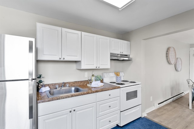1023 W Maxwell Ave, Spokane, WA 99201 - kitchen featuring freestanding refrigerator, baseboard heating, electric range, under cabinet range hood, and white cabinets