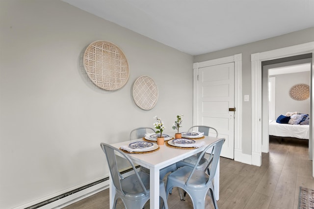 1023 W Maxwell Ave, Spokane, WA 99201 - dining area with baseboard heating and wood finished floors