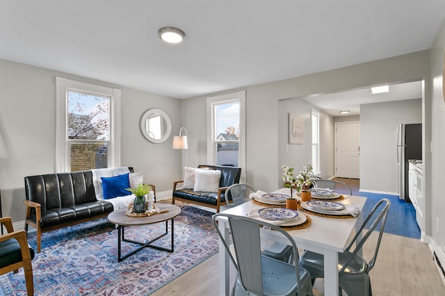 1023 W Maxwell Ave, Spokane, WA 99201 - dining space featuring light wood-style flooring and baseboards
