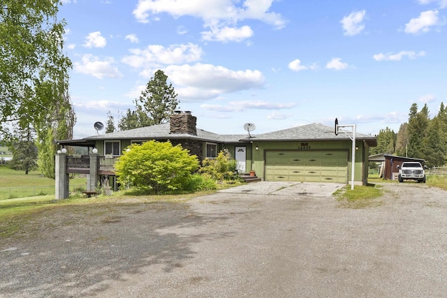 15906 N Forker Rd, Spokane, WA 99217 - ranch-style house featuring dirt driveway, an attached garage, a chimney, and a carport