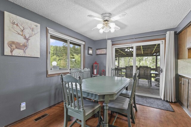 15906 N Forker Rd, Spokane, WA 99217 - dining area featuring ceiling fan, a textured ceiling, and wood finished floors