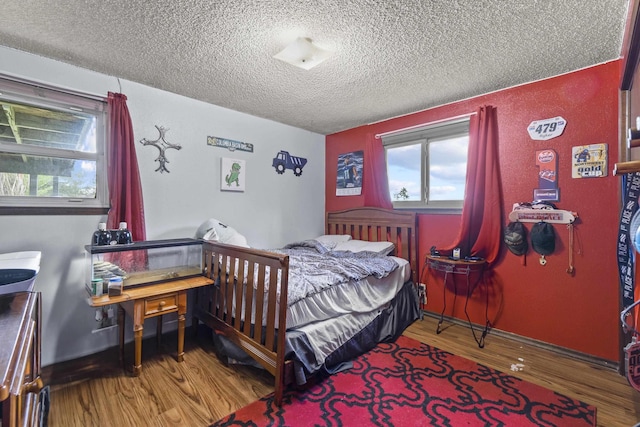 15906 N Forker Rd, Spokane, WA 99217 - bedroom with a textured ceiling and wood finished floors