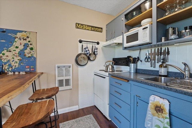 28600 N Mt Spokane Park Dr Unit 612, Mead, WA 99021 - kitchen with white appliances, under cabinet range hood, open shelves, dark countertops, and dark wood-style floors