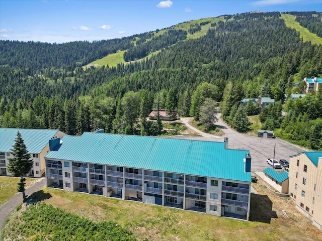 28600 N Mt Spokane Park Dr Unit 612, Mead, WA 99021 - drone / aerial view of a heavily wooded area and a mountainous background