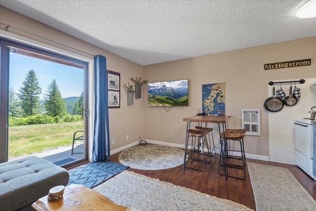 28600 N Mt Spokane Park Dr Unit 612, Mead, WA 99021 - dining room featuring healthy amount of natural light, wood finished floors, and a textured ceiling