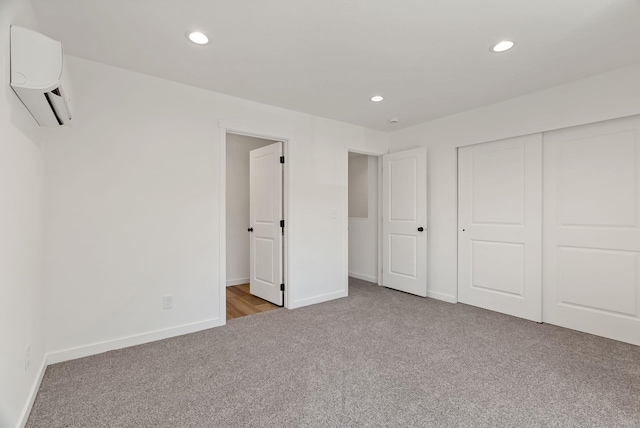 2321 E 7th Avenue 2323E 7Th Ave, Spokane, WA 99202 - unfurnished bedroom with a wall mounted air conditioner, carpet, recessed lighting, and a closet
