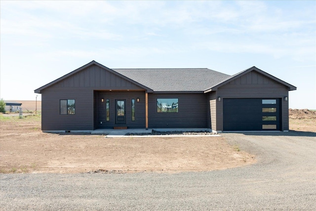 25751 Westfield Ln, Davenport, WA 99122 - view of front of home with a garage, driveway, and a shingled roof