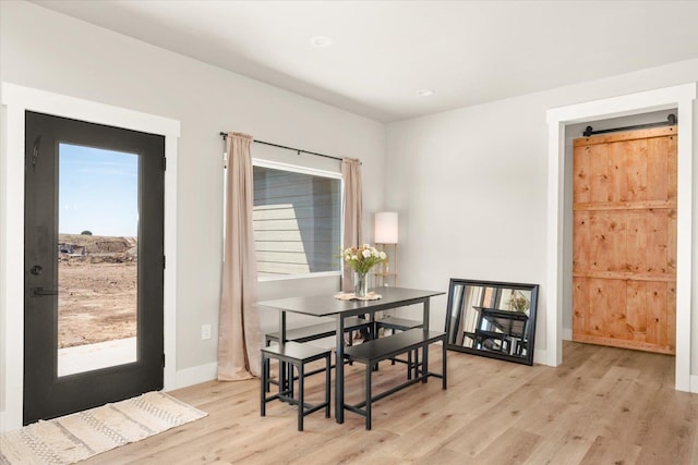 25751 Westfield Ln, Davenport, WA 99122 - dining space featuring light wood-style floors and a barn door