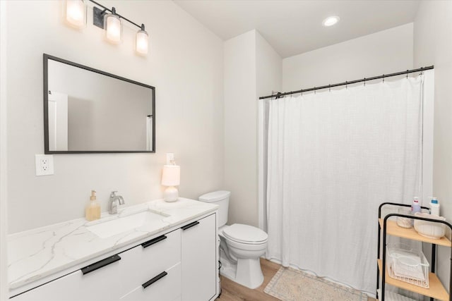 25751 Westfield Ln, Davenport, WA 99122 - bathroom with vanity, wood finished floors, curtained shower, and recessed lighting