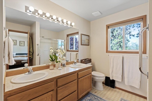 4108 S Greystone Ln, Spokane, WA 99223 - ensuite bathroom featuring a stall shower and double vanity