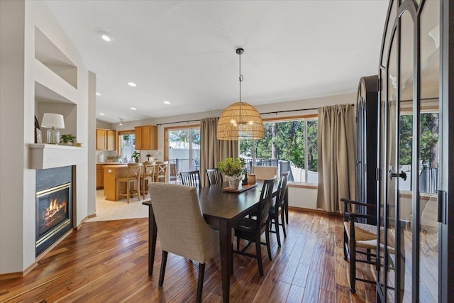 4108 S Greystone Ln, Spokane, WA 99223 - dining space with hardwood / wood-style floors, a glass covered fireplace, and recessed lighting