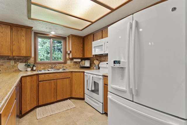 3827 E Funk Ave, Spokane, WA 99223 - kitchen with white appliances, brown cabinets, tasteful backsplash, and a textured ceiling
