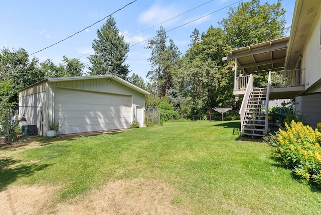 3827 E Funk Ave, Spokane, WA 99223 - view of yard featuring stairway, a garage, and an outbuilding