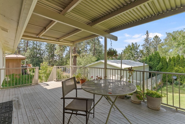 3827 E Funk Ave, Spokane, WA 99223 - wooden terrace with view of scattered trees and outdoor dining space