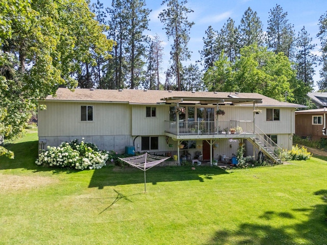 3827 E Funk Ave, Spokane, WA 99223 - back of house featuring stairway, a deck, and a lawn