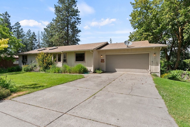 3827 E Funk Ave, Spokane, WA 99223 - ranch-style house with an attached garage, a front lawn, and concrete driveway