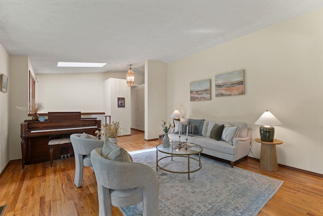 3827 E Funk Ave, Spokane, WA 99223 - living room with a skylight and light wood-style flooring
