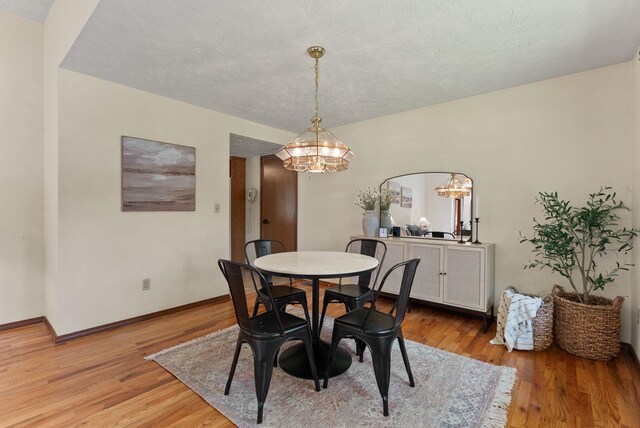 3827 E Funk Ave, Spokane, WA 99223 - dining room with a chandelier and light wood-style floors