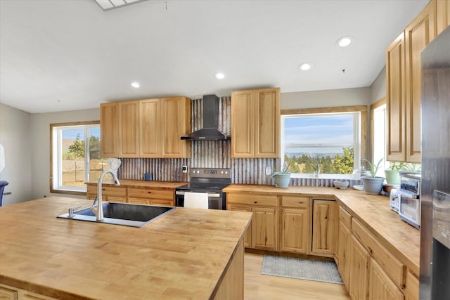 36127 N Hart Rd, Davenport, WA 99122 - kitchen featuring wood counters, wall chimney range hood, electric range, light brown cabinets, and recessed lighting