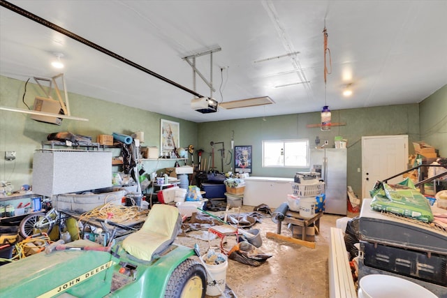 36127 N Hart Rd, Davenport, WA 99122 - garage with a garage door opener and stainless steel fridge