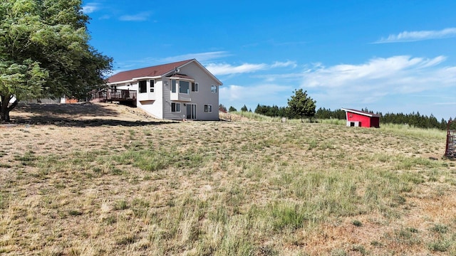 36127 N Hart Rd, Davenport, WA 99122 - view of yard featuring a deck and an outdoor structure