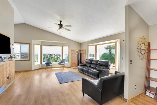 36127 N Hart Rd, Davenport, WA 99122 - living room with vaulted ceiling, plenty of natural light, light wood-style flooring, and ceiling fan