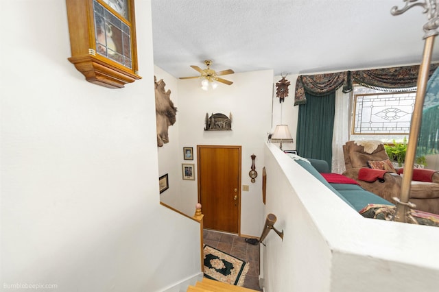 4511 N Stevenson Rd, Otis Orchards, WA 99027 - staircase with a textured ceiling and ceiling fan