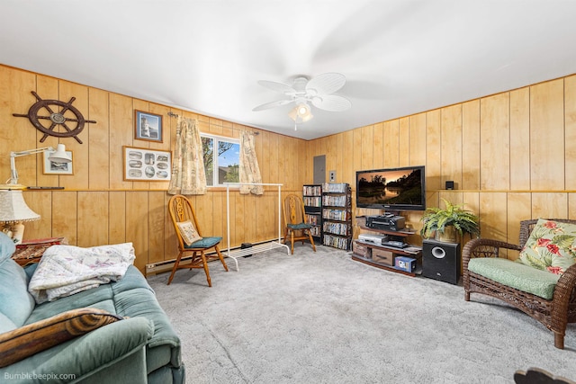 4511 N Stevenson Rd, Otis Orchards, WA 99027 - carpeted living room featuring wood walls and a ceiling fan