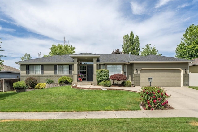 6310 W Sundance Dr, Spokane, WA 99208 - view of front of house with a garage, brick siding, and concrete driveway