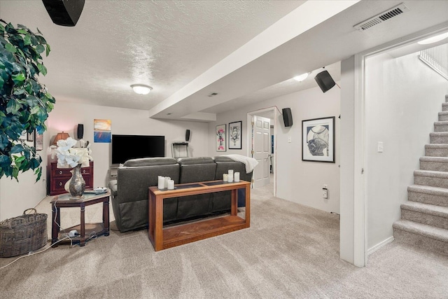 6310 W Sundance Dr, Spokane, WA 99208 - carpeted living area featuring stairway and a textured ceiling