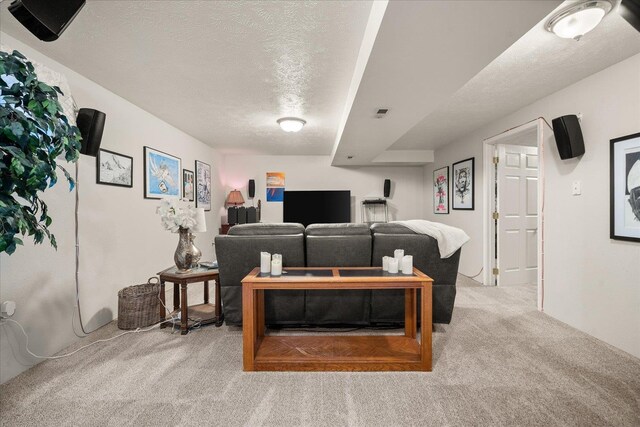 6310 W Sundance Dr, Spokane, WA 99208 - carpeted living room featuring a textured ceiling