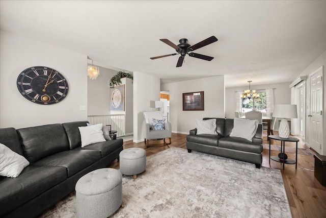 6310 W Sundance Dr, Spokane, WA 99208 - living area featuring a chandelier, wood finished floors, and ceiling fan
