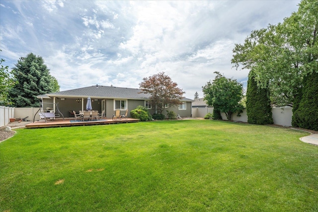 6310 W Sundance Dr, Spokane, WA 99208 - fenced backyard with a wooden deck
