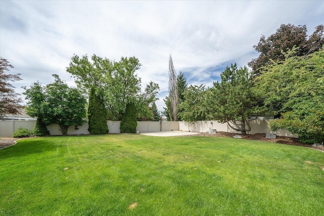 6310 W Sundance Dr, Spokane, WA 99208 - fenced backyard featuring a patio area