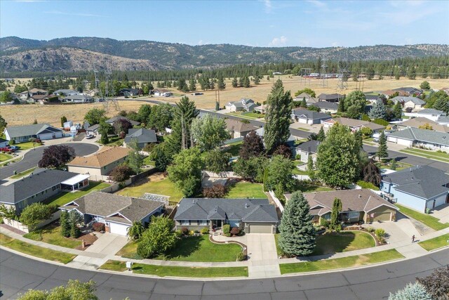 6310 W Sundance Dr, Spokane, WA 99208 - aerial view of residential area with a mountainous background
