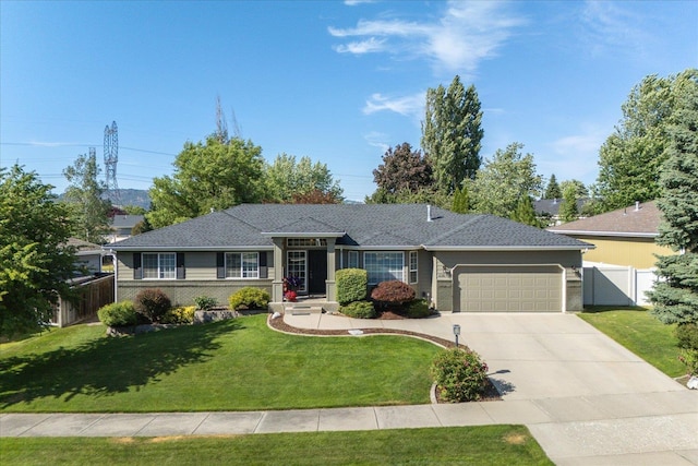 6310 W Sundance Dr, Spokane, WA 99208 - ranch-style home featuring an attached garage, driveway, and brick siding