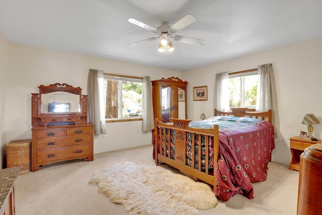3930 N Deer Lake Rd, Loon Lake, WA 99148 - carpeted bedroom featuring multiple windows and a ceiling fan